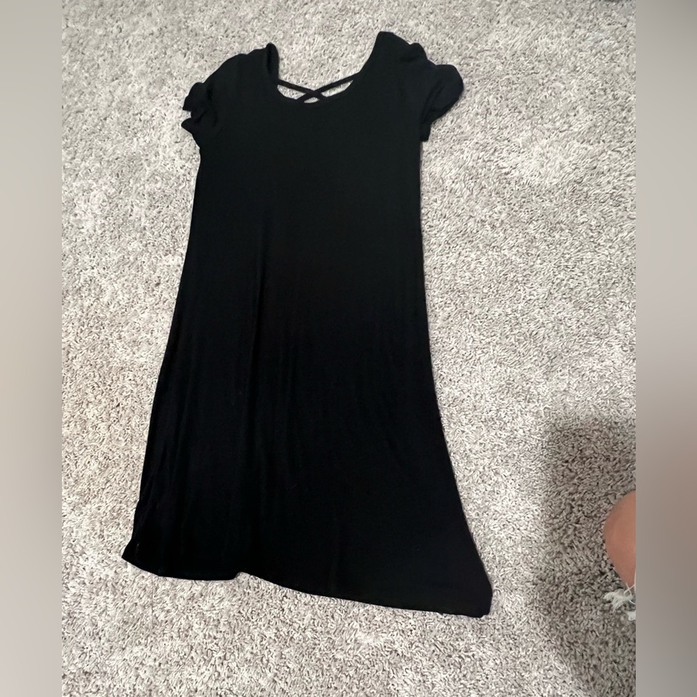 Black dress with crossed back. Size medium, never worn.